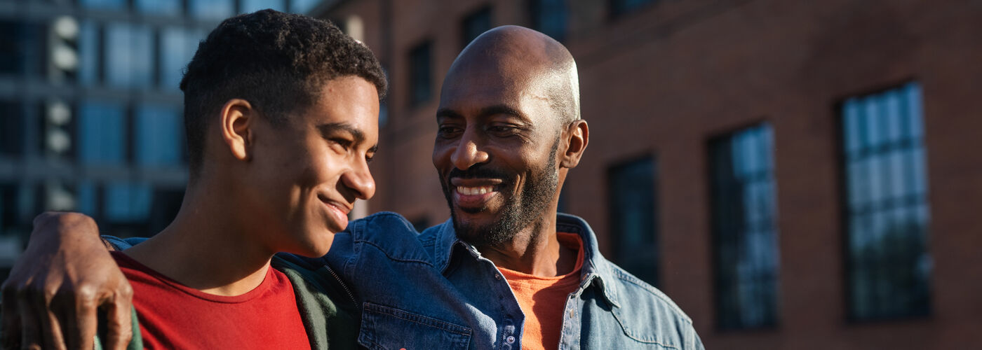 Father and son together smiling