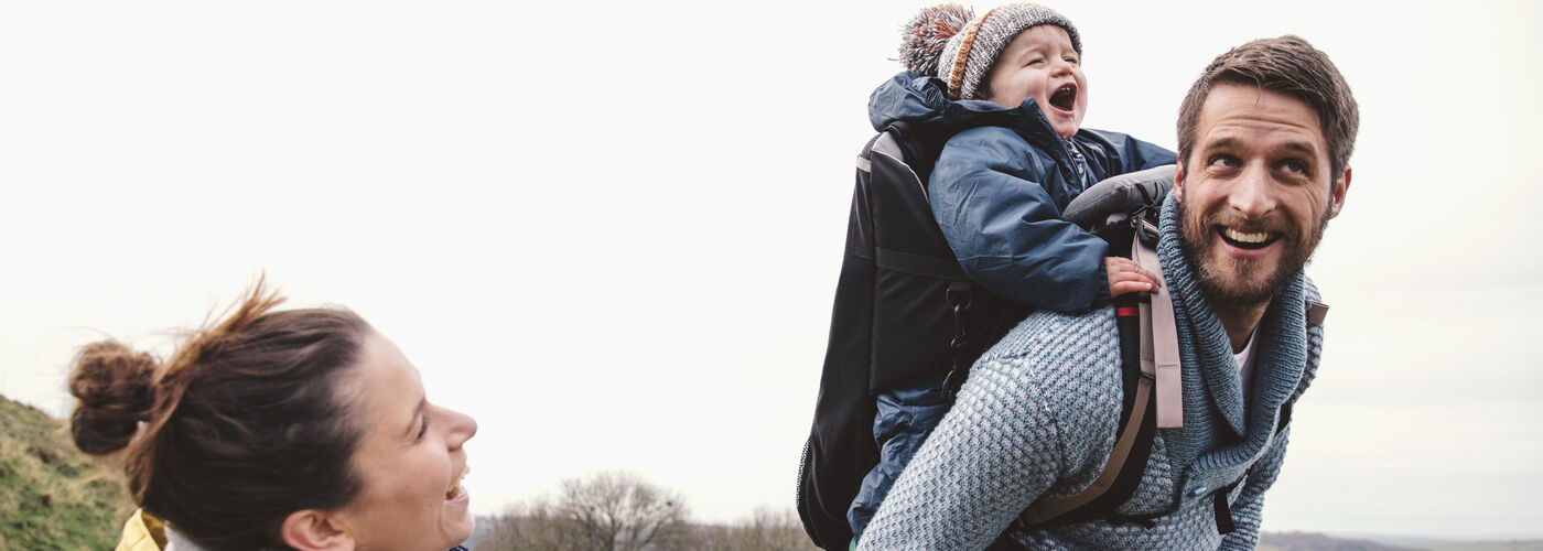 Happy family on a healthy hike with a toddler