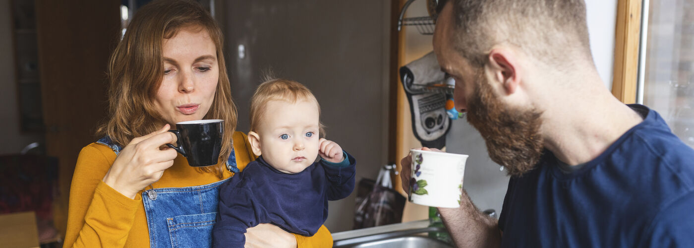 A family with a toddler enjoying a healthy morning brew