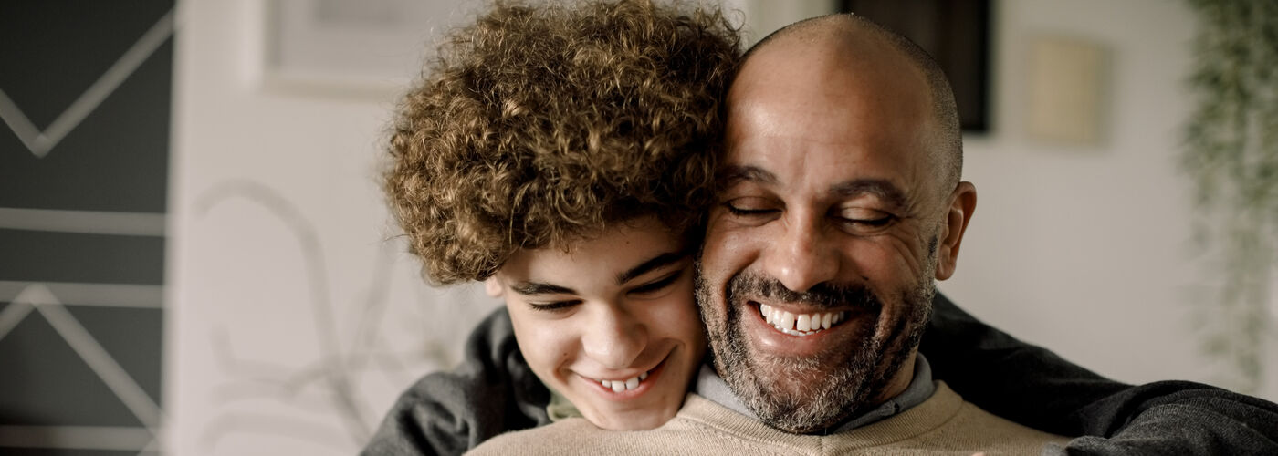 father and son smiling