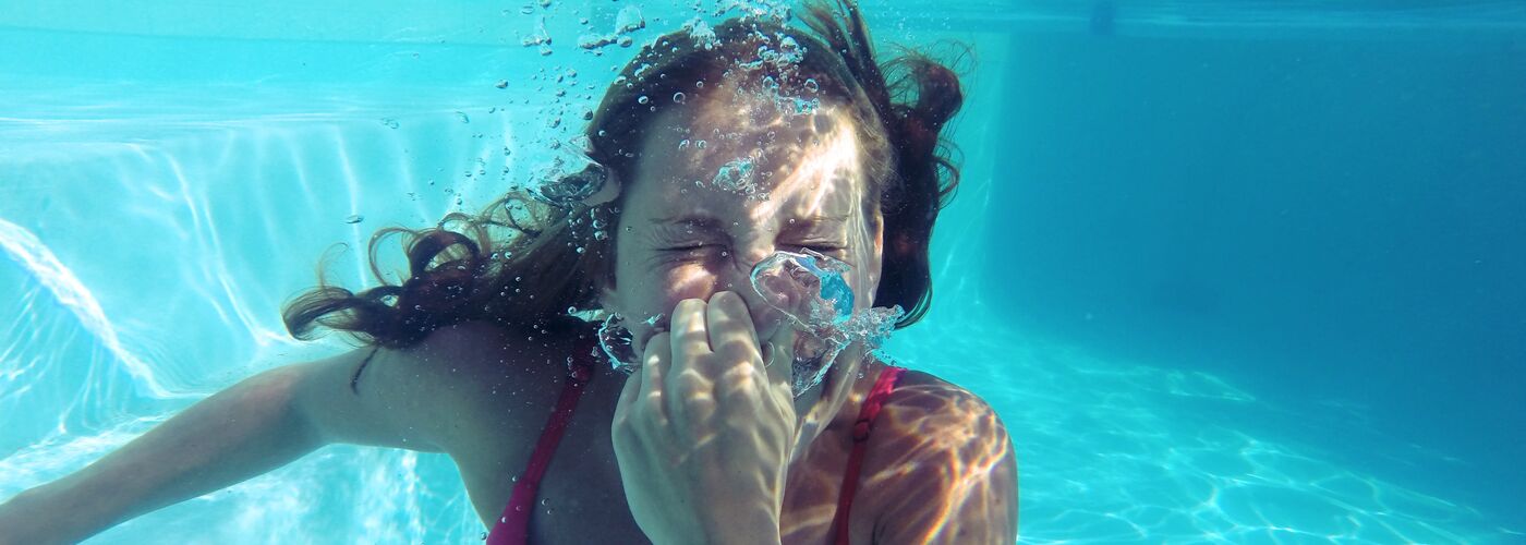 Lady swimming underwater
