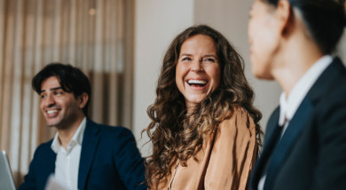 A mother checking her emails with a toddler on her lap