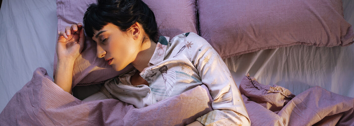 Woman Sleeping Peacefully In a Bed