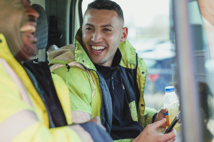 Two men laughing in the workplace