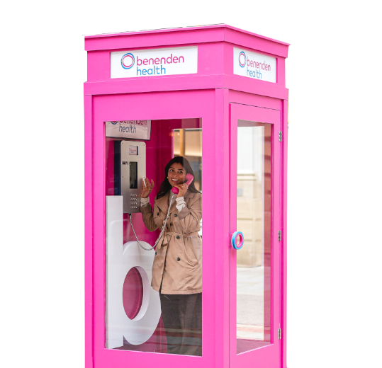 A lady in a phonebox