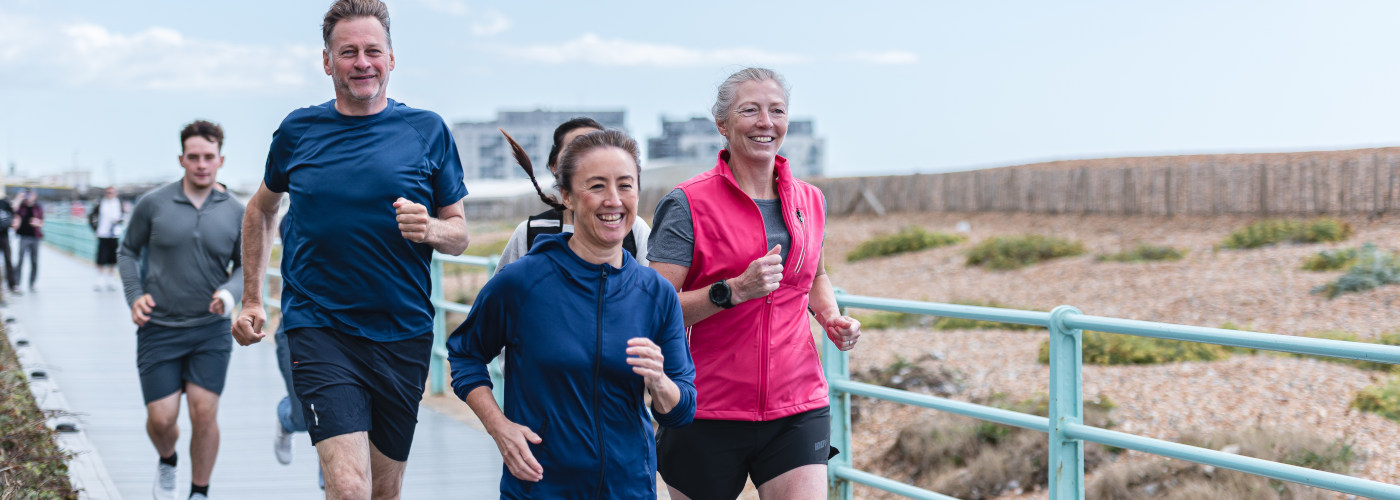 A group of mixed runners outside