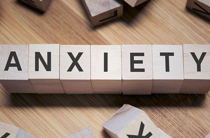 Anxiety word written wooden cubes
