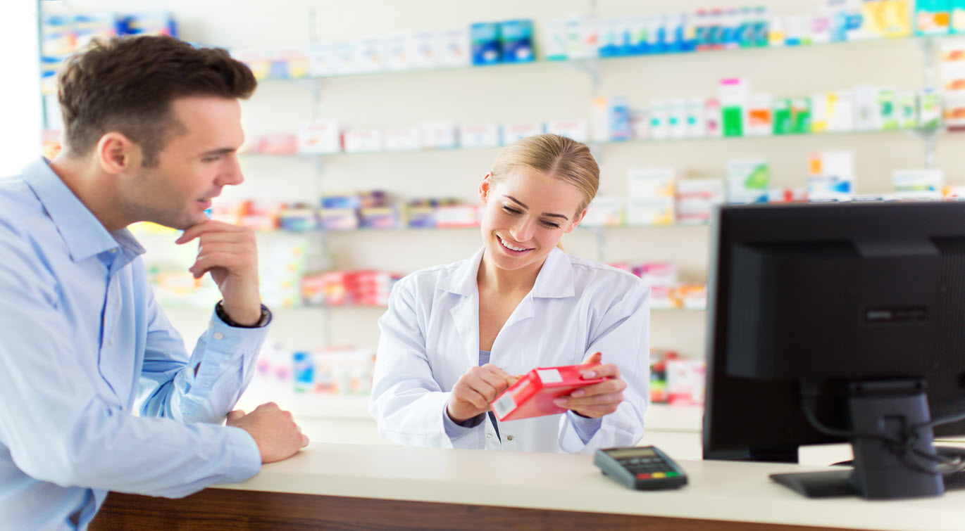 Pharmacist advising patient