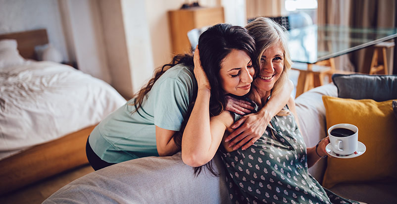 Mother and daughter hugging 