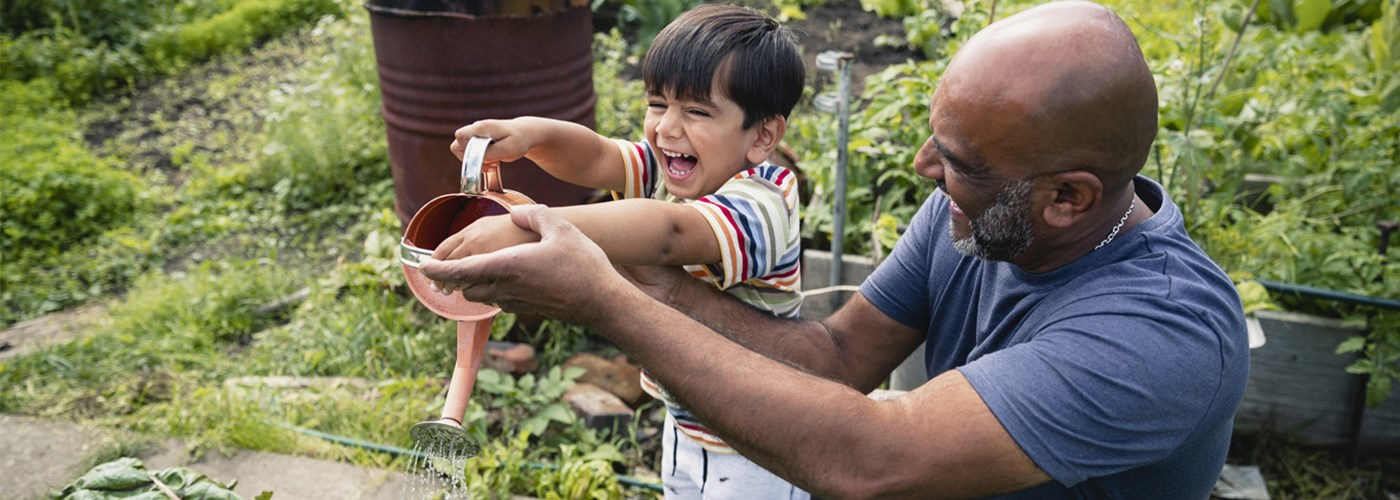 grandfather_has_fun_with_grandson_in_the_garden