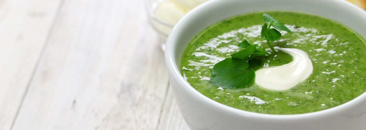 Nourishing super green soup in a bowl