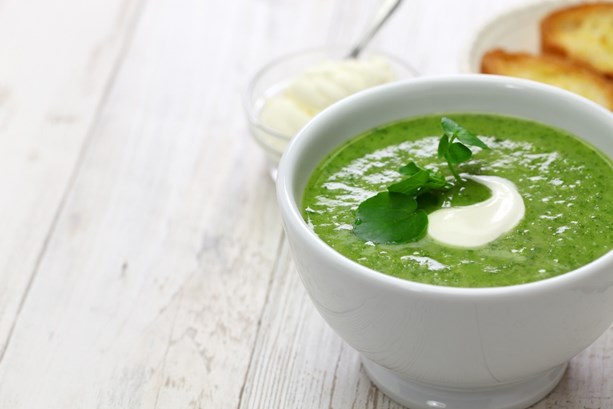 Nourishing super green soup in a bowl