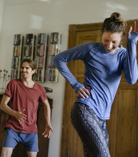 Couple exercising in their living room