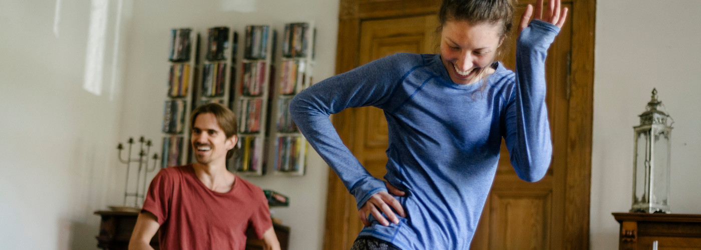 Couple exercising in their living room