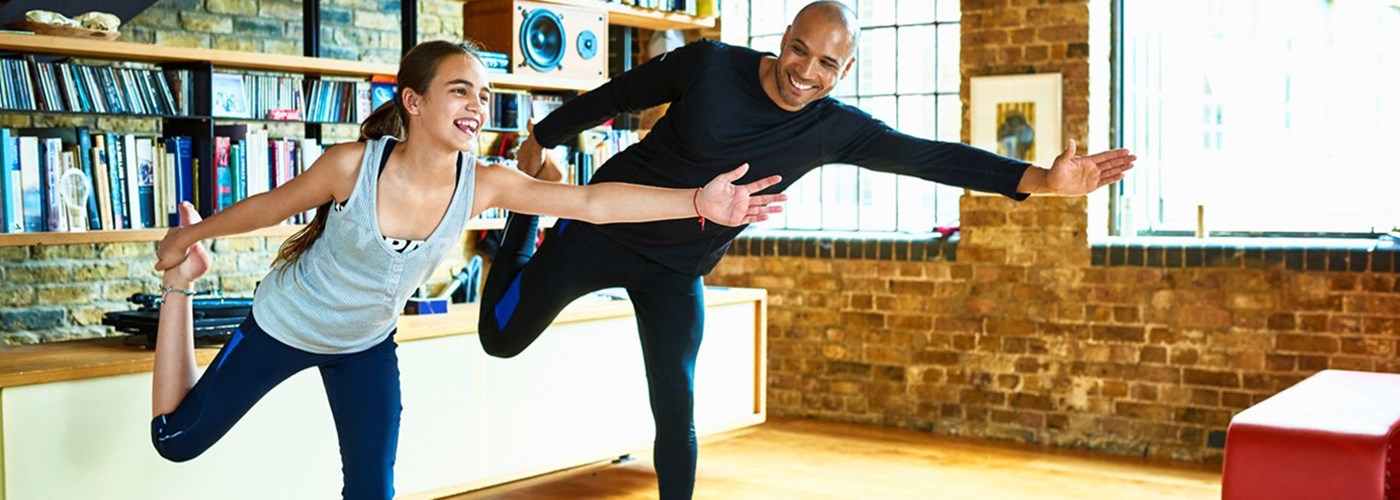 Father and daughter exercising for mindfulness