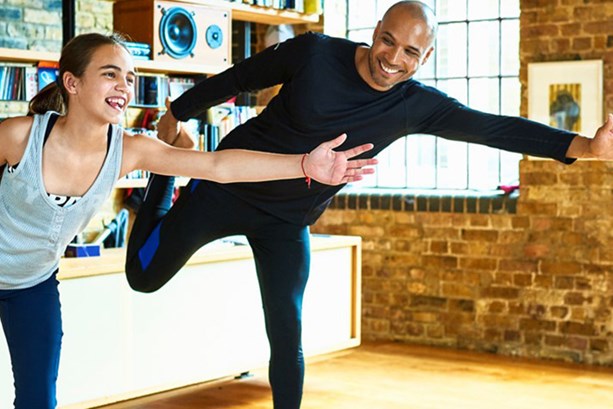 Father and daughter exercising for mindfulness