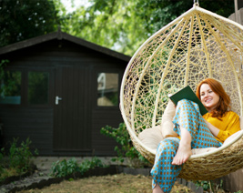 Young woman reading in the garden
