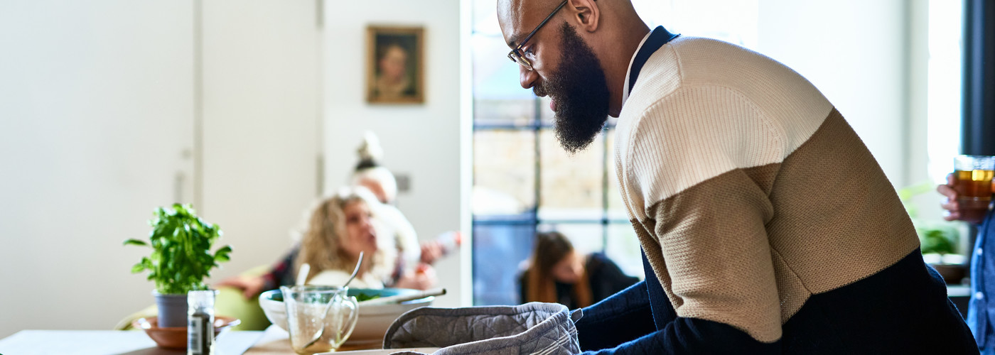A man cooking a healthy dinner at home