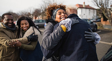 Family members embracing outdoors