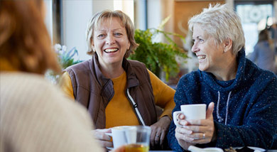 Two ladies catching up over a cup of tea