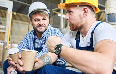 Two men chatting at work 