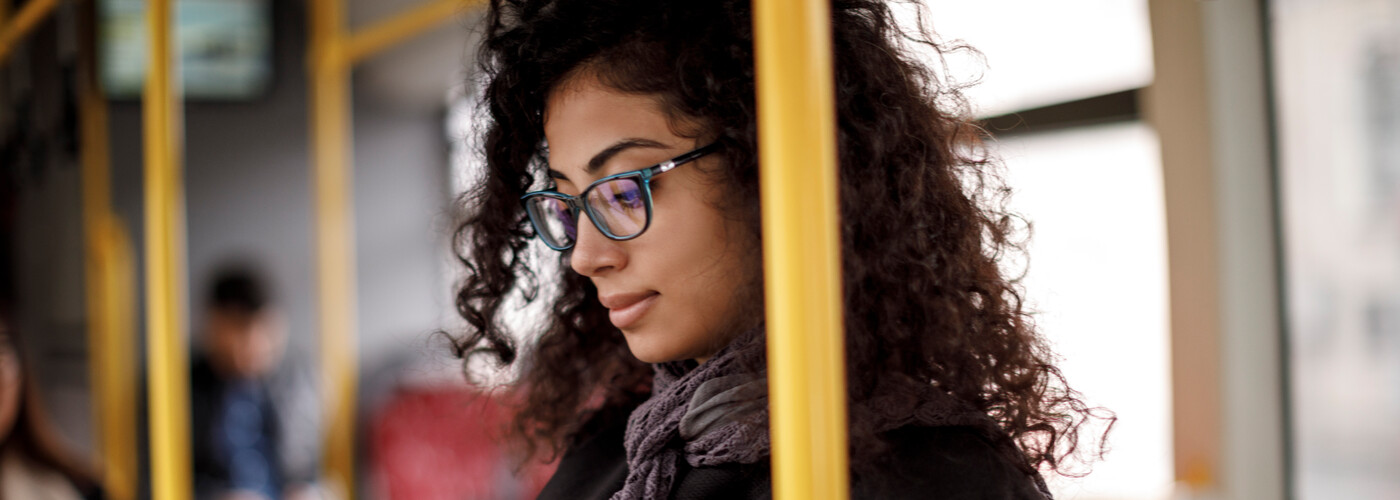 Young woman traveling by bus
