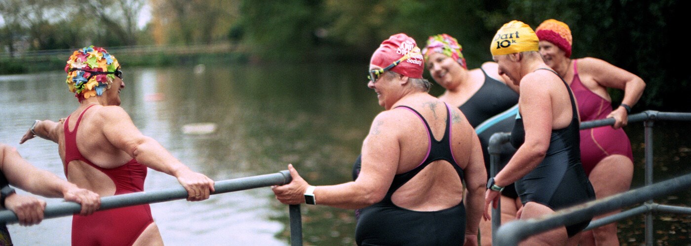 A group of middle aged ladies wild river swimming