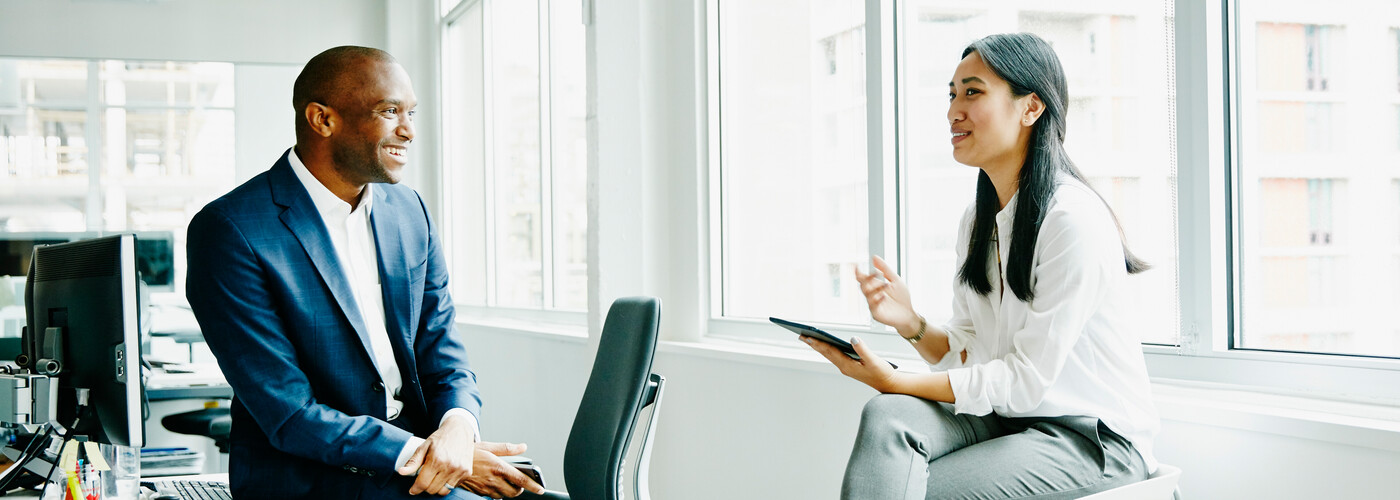 male and female colleagues discussing project