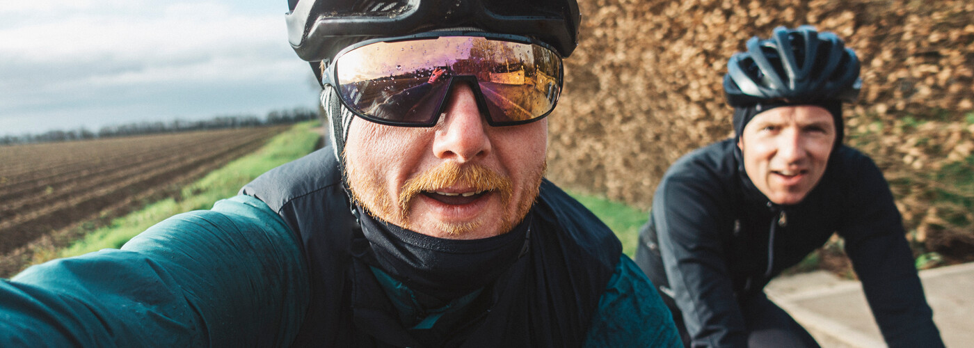 Two men biking around countryside hero