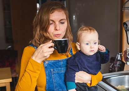 Young mother holding a toddler