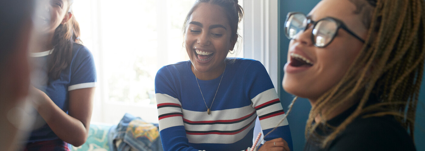 Teen girls laughing relaxed